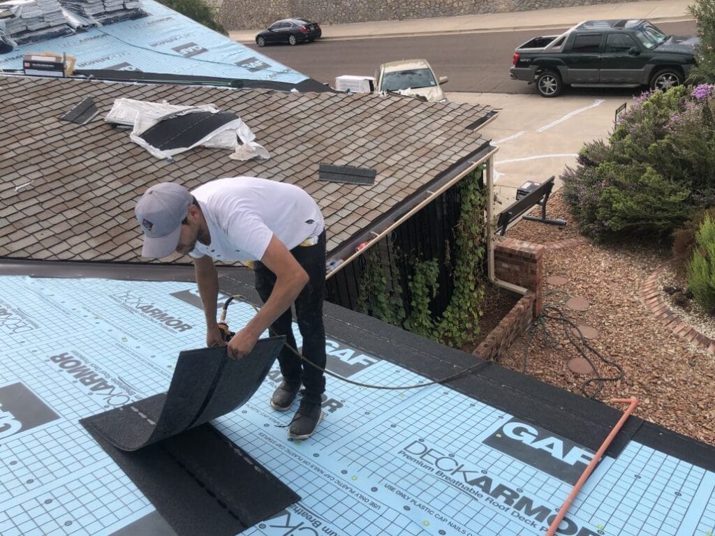 Man Working On House Roof - Smith & Ramirez Residential Roofing Services