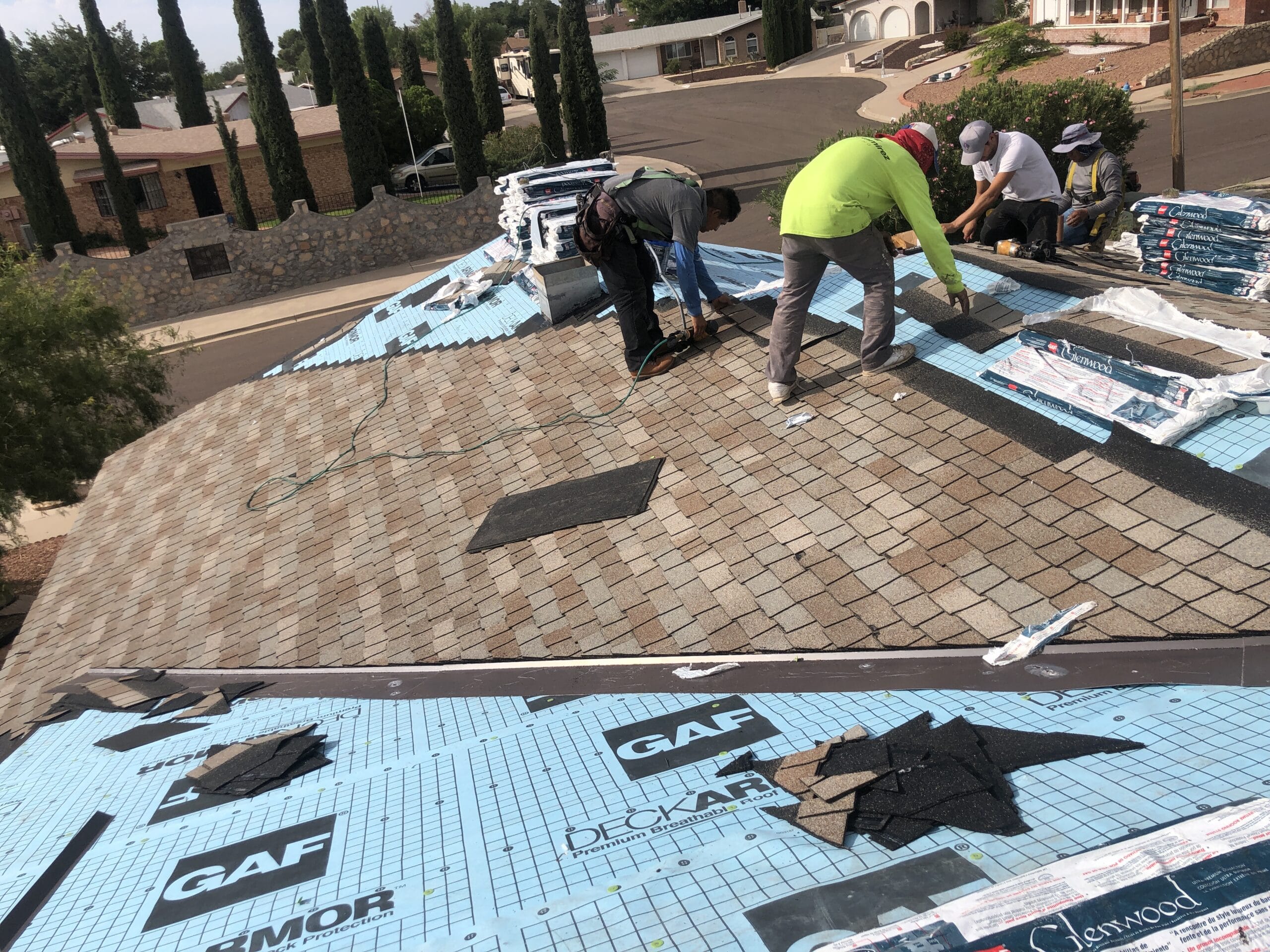 two workers doing residential roofing in el paso