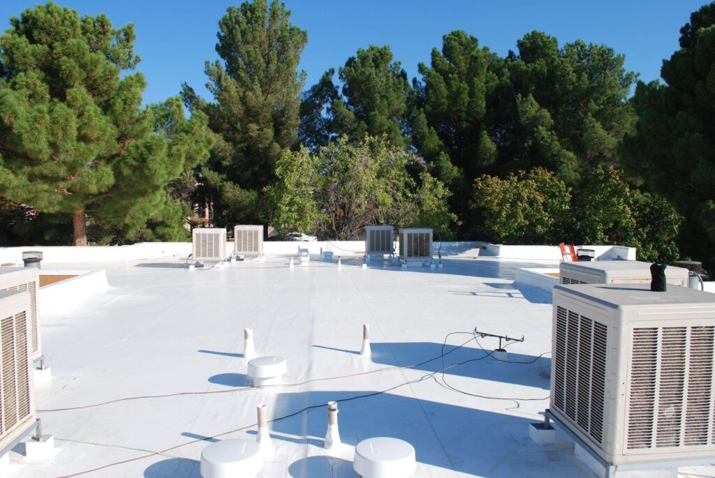 A commercial roof with a white coating