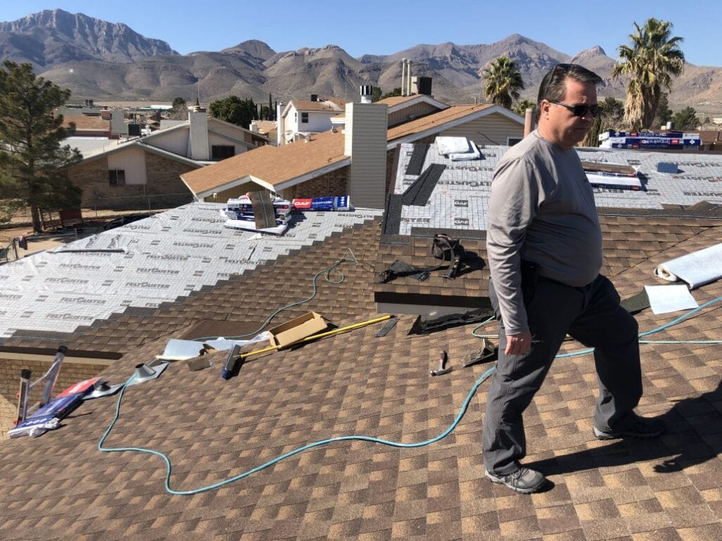 Worker On House Roof - Smith & Ramirez Residential Roofing Services